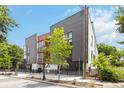 Modern building featuring a combination of metal, wood, and white finishes with mature trees at 367 Parkway Ne Dr # 7, Atlanta, GA 30312