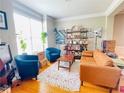 Cozy living room with hardwood floors, comfortable seating, and stylish decor at 5771 Vinings Retreat Sw Way, Mableton, GA 30126