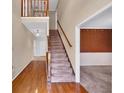 Elegant foyer with hardwood floors and staircase at 5148 Coolamber Dr, Powder Springs, GA 30127
