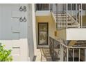 Close up of front door, showing unit numbers and stairway to upper units at 68 La Rue Nw Pl, Atlanta, GA 30327