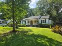 Charming single story home with a welcoming front porch and well-manicured lawn at 1617 Columbia Circle, Decatur, GA 30030