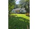 Charming single story home with a welcoming front porch and well-manicured lawn at 1617 Columbia Circle, Decatur, GA 30030