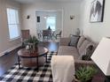 Cozy living room featuring modern decor, natural light, and an open layout to the dining area at 1617 Columbia Circle, Decatur, GA 30030