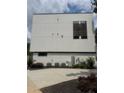 Back exterior showcasing painted brick, white siding, and modern design at 2424 Memorial Drive Se Dr # 3, Atlanta, GA 30317