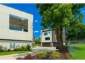View of modern townhomes with private driveway and beautifully landscaped greenery at 2424 Memorial Drive Se Dr # 3, Atlanta, GA 30317