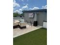 Rooftop patio with modern furniture, outdoor heater, and artificial turf, ideal for entertaining at 2424 Memorial Drive Se Dr # 7, Atlanta, GA 30317