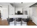 Contemporary kitchen with marble counters, stainless steel appliances, and breakfast bar seating for three at 1029 Piedmont Ne Ave # 202, Atlanta, GA 30309