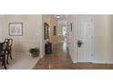 Hallway featuring hardwood floors, neutral paint, with a carpeted dining space on the left at 126 Woodbury Ln, Canton, GA 30114