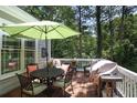 Inviting outdoor patio features a dining table, seating, and grill, perfect for entertaining and relaxation at 126 Woodbury Ln, Canton, GA 30114