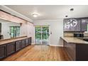 Kitchen featuring modern appliances, granite countertops, and wood floors, perfect for cooking and entertaining at 9055 Green Valley Ct, Douglasville, GA 30134