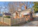 Quaint brick home featuring a picket fence and mature trees in a desirable location at 1015 Deckner Sw Ave, Atlanta, GA 30310