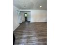 Spacious living room with modern gray wood flooring and fresh neutral paint at 10591 Flat Shoals Rd Rd, Covington, GA 30016