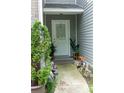Inviting entrance with decorative plants and charming walkway lights at 5590 Stonewood Court Ct, Norcross, GA 30093