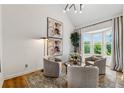 Living room showcasing vaulted ceiling, art piece, and bay windows with relaxing nature views at 904 Ivy Green Se Ln, Marietta, GA 30067