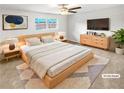 Staged main bedroom with updated decor and furniture at 6354 Shannon Pkwy # 8B, Union City, GA 30291