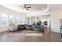 Large living room with hardwood floors, recessed lighting, and multiple windows providing ample sunlight at 905 Eldridge Rd, Hampton, GA 30228