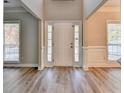 Bright entryway with beautiful wood-look flooring and natural light at 2035 Lena Carter Rd, Buford, GA 30519