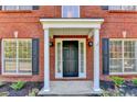 Close up of front door with white columns and black shutters at 2035 Lena Carter Rd, Buford, GA 30519