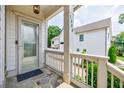 Charming front porch with stone flooring and a view of the landscaped yard at 1505 Walker Ave, College Park, GA 30337