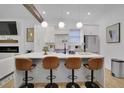Stylish kitchen with a center island, stainless steel appliances, and modern pendant lighting at 701 Smith St, Atlanta, GA 30310