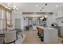 Open-concept living space with a kitchen island, dining area, and a cozy living room at 701 Smith St, Atlanta, GA 30310