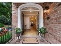 Inviting entrance with double doors opening to a bright foyer and hardwood floors at 2584 Oglethorpe Ne Cir, Brookhaven, GA 30319