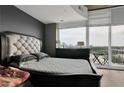 Bedroom with large window views, a comfortable bed, and plenty of natural light at 361 17Th St # 1121, Atlanta, GA 30363
