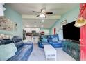 Inviting living room open to kitchen with modern ceiling fan and comfortable seating at 2619 Old Toney Rd, Ellenwood, GA 30294