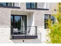 Cozy balcony with comfortable seating for enjoying the outdoor scenery and fresh air at 7220 Summit Pl, Alpharetta, GA 30009