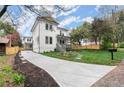 Long driveway leads to a well-maintained home with fresh landscaping and a spacious front yard at 779-A Lynwood Se St, Atlanta, GA 30312