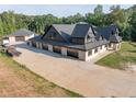 A charming one story home with a large roof and six car garage at 1730 Etchison Spur, Loganville, GA 30052