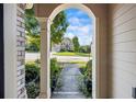 View from front porch looking out to a beautifully landscaped yard and street at 3952 Dragon Fly Ln, Loganville, GA 30052
