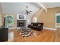Spacious living room with vaulted ceilings, wood floors, stone fireplace and plenty of light at 1105 Tom Lane Ln, Marietta, GA 30066