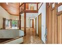 Warm home entryway featuring hardwood floors, a wood ceiling, and open floorplan at 562 Pine Valley Se Rd, Marietta, GA 30067