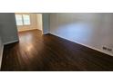 Inviting living room with gleaming hardwood floors and light gray paint at 1106 Sharonton Way, Stone Mountain, GA 30083