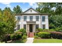 Charming two-story home with well-manicured landscaping and covered front porch at 1215 Renaissance Se Ct, Mableton, GA 30126