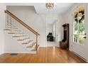 Bright foyer features hardwood floors, staircase, and view of office at 1215 Renaissance Se Ct, Mableton, GA 30126