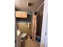 Bathroom with shower and toilet at 184 Nathan Sw Rd, Atlanta, GA 30331
