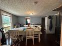 Dining room with seating for six people and hardwood floors at 184 Nathan Sw Rd, Atlanta, GA 30331