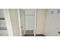 Spacious closet interior offering ample storage with convenient access to shelves and a door at 5595 Marbut Rd, Lithonia, GA 30058