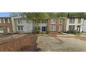 Inviting townhomes featuring distinctive entrances and convenient parking areas in a residential neighborhood at 5595 Marbut Rd, Lithonia, GA 30058