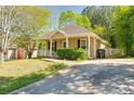 Well-maintained home features a tidy lawn and driveway, complementing the home's neutral exterior at 179 Glynn Addy Dr, Stockbridge, GA 30281