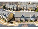 Aerial view of townhome community showcasing well-maintained exteriors and landscaping at 3898 High Dove Sw Way # 12, Smyrna, GA 30082