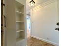 Entryway area with decorative tiled floors, bright lighting and a built-in shelving unit at 2285 Peachtree Ne Rd # 1202, Brookhaven, GA 30309