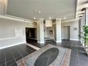 A commercial building lobby area featuring a large rug and tile flooring at 2285 Peachtree Ne Rd # 1202, Brookhaven, GA 30309