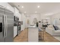 Modern kitchen with stainless steel appliances, granite countertops, breakfast bar, and open view to the living area at 1020 Merritt Dr # 11, Villa Rica, GA 30180