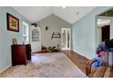 Neutral living room showcasing hardwood floors, storage, and a doorway to another room at 4636 Chamblee Tucker Rd, Tucker, GA 30084