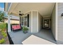 Cozy front porch with a swing, ceiling fan, and grey accents, perfect for relaxing outdoors at 507 Bonneset Ct, Canton, GA 30114