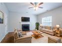 Cozy living room featuring a fireplace, plush seating, and hardwood floors at 6207 Idlewood Cir, Lithonia, GA 30038