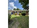 Quaint single-story brick home with inviting front yard and white door at 1098 Laurel Nw Ln, Conyers, GA 30012